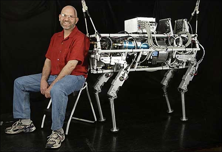 CAPTION: CAMBRIDGE, MASS.--9/11/2004--BostonDynamics president Marc Raibert with the robot "Big Dog". CREDIT: JODI HILTON FOR THE NEW YORK TIMES